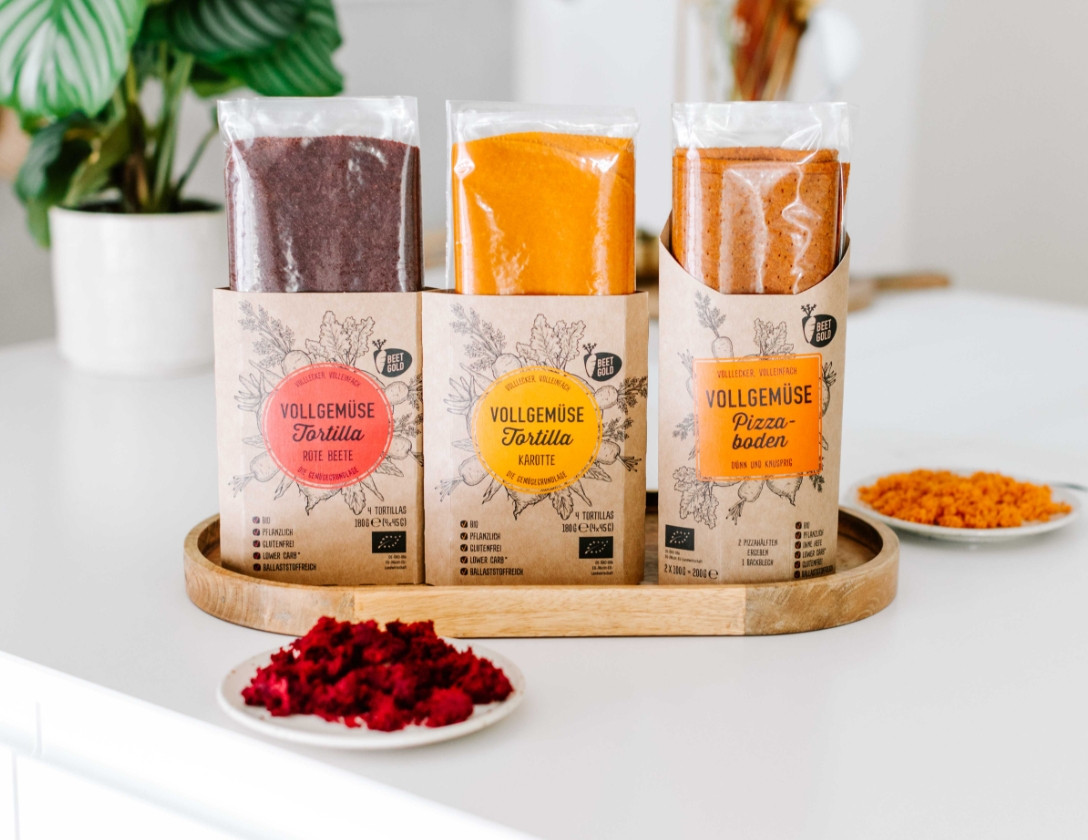 Drei Beetgold Produkte, Rote Beete Tortilla, Karotten Tortilla und Pizzaboden aus Gemüsetrester